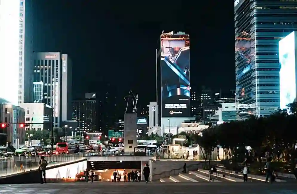 The statue of Admiral Yi Sun-sin at Gwanghwamun Square and the night streets of Seoul